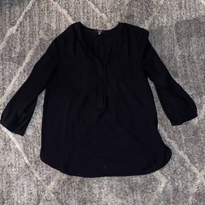 Quarter sleeve black shirt with fake pocket detail and fun detail on back.